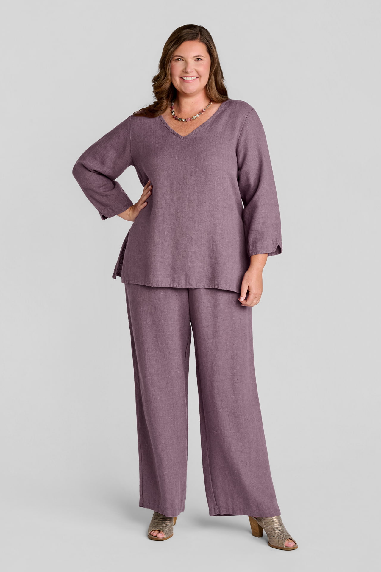 Woman in pink linen pullover with pink linen pants