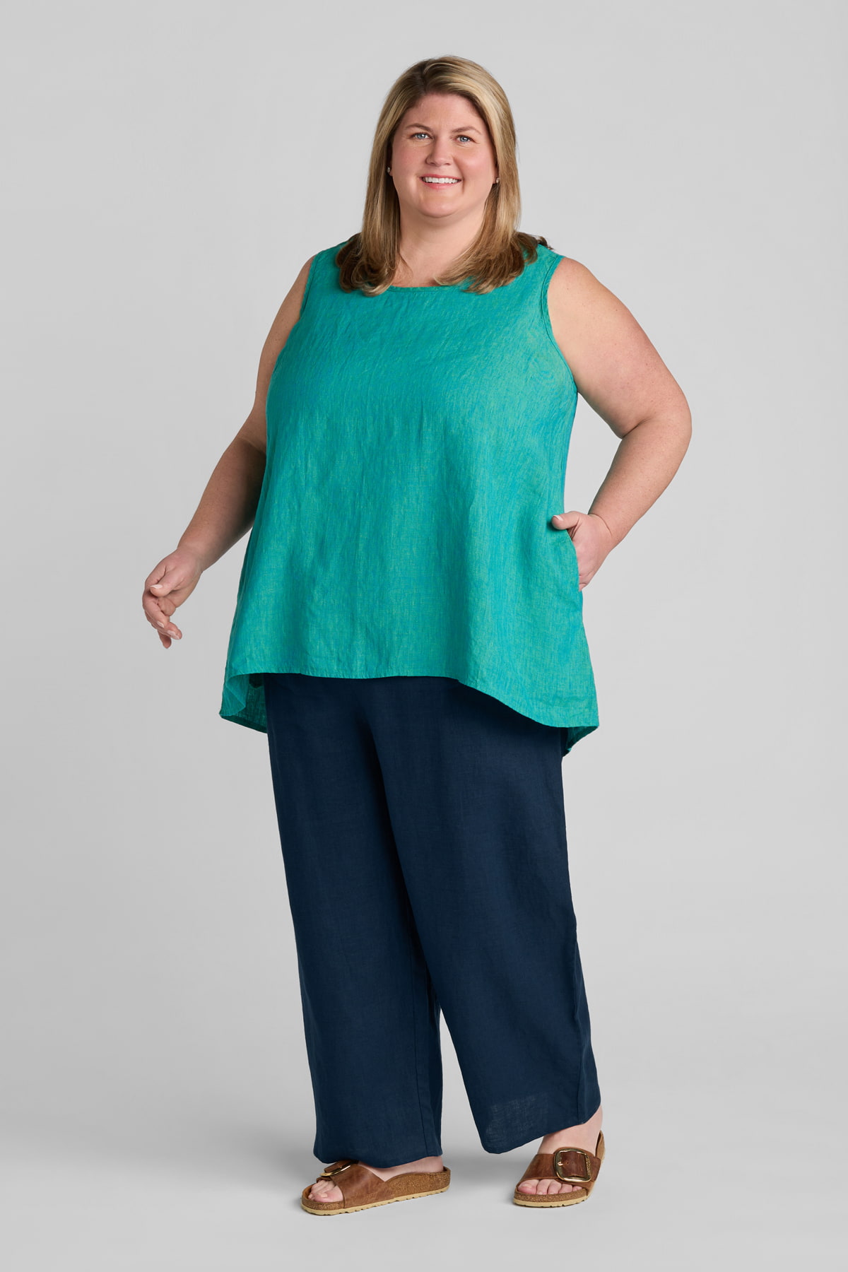 Woman in blue linen tank top and blue linen pants